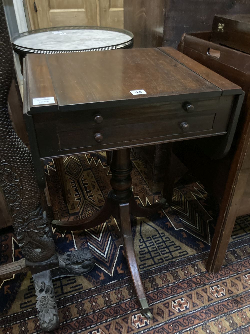 A Regency mahogany drop flap games / writing table, width 50cm depth 40cm height 73cm